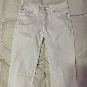 Girls White jeans. Light tiny stain by the tag but NOT noticeable when wearing.